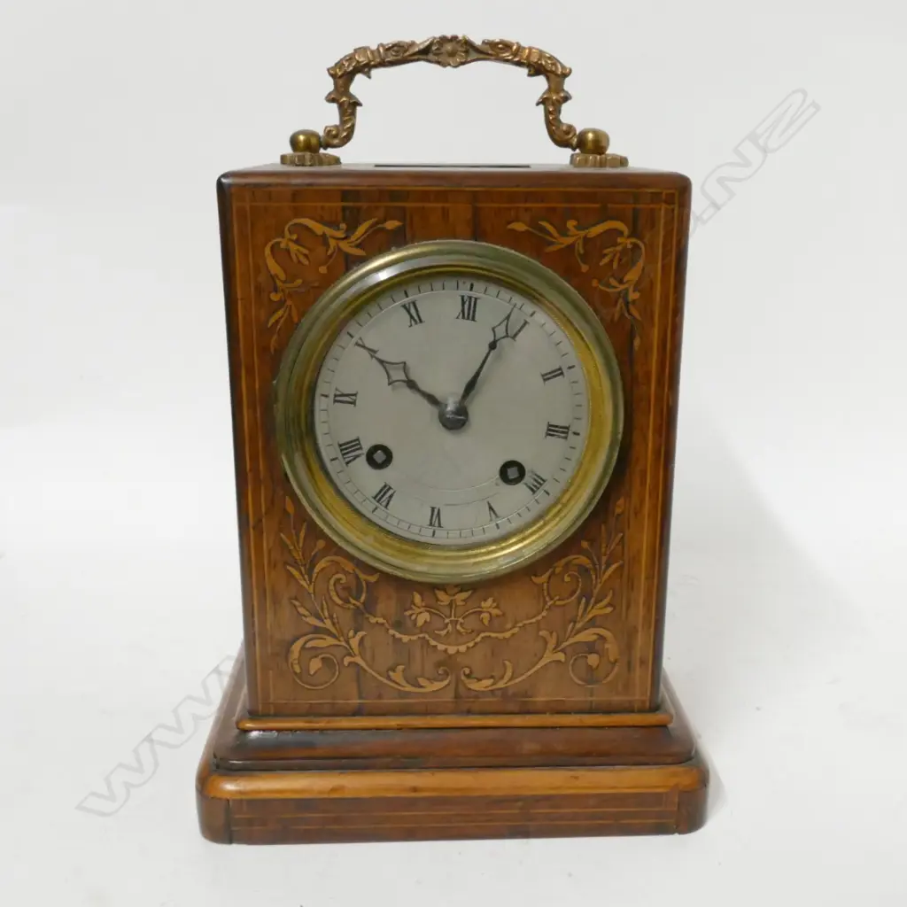 A French mantel clock with inlaid timber case Image 1++