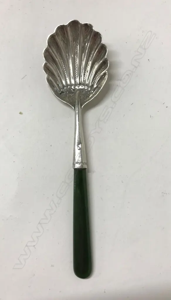 A silver and pounamu handled jam spoon Image 1++