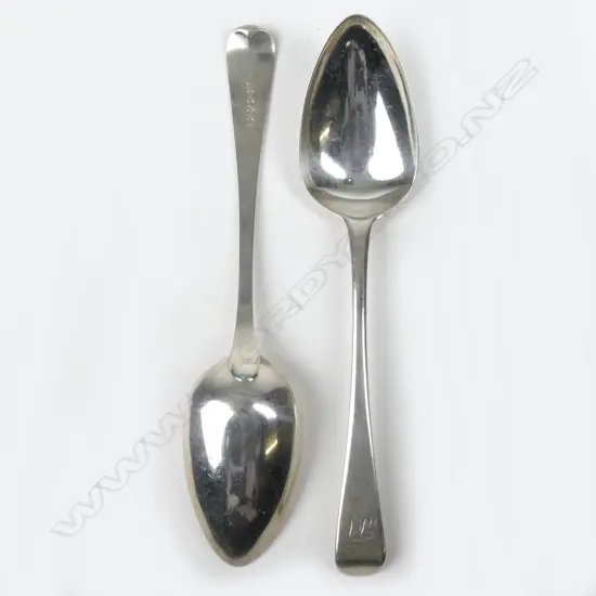 A pair of George III crested Old English silver tablespoons