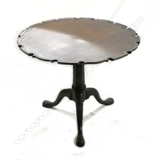 A Georgian mahogany tilt-top birdcage pie-crust wine table