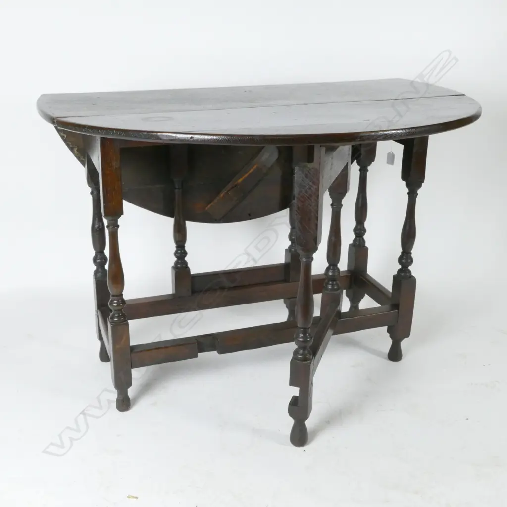 A George III country oak gate-leg table Image 1++