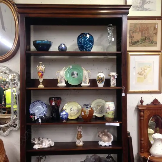 A tall oak Sefton Powrie bookcase