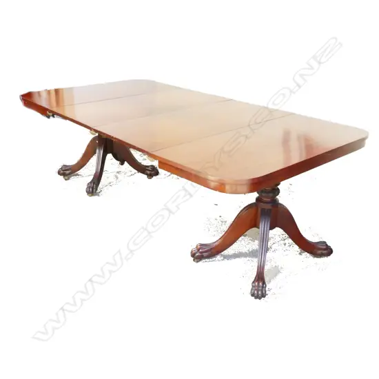 A good quality reproduction mahogany extension dining table