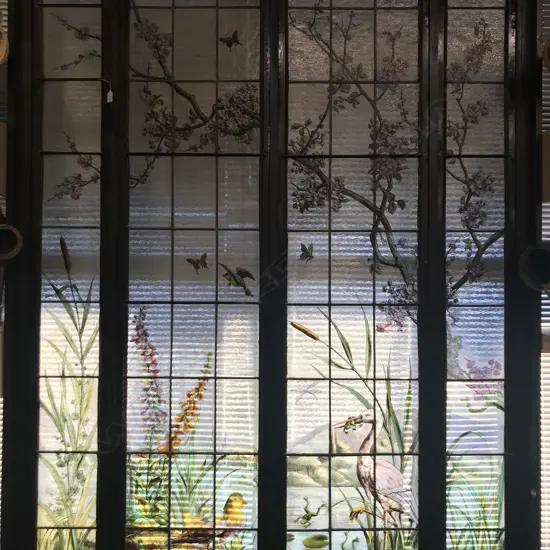 A large and impressive Arts and Crafts stained glass window