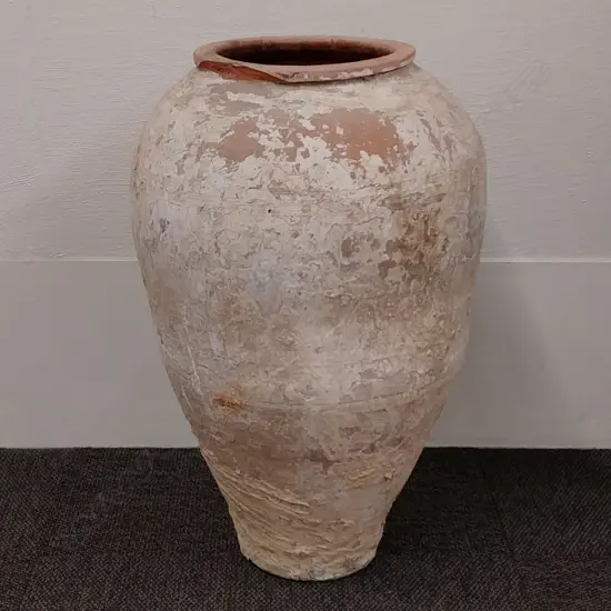 An old Turkish terracotta olive oil jar