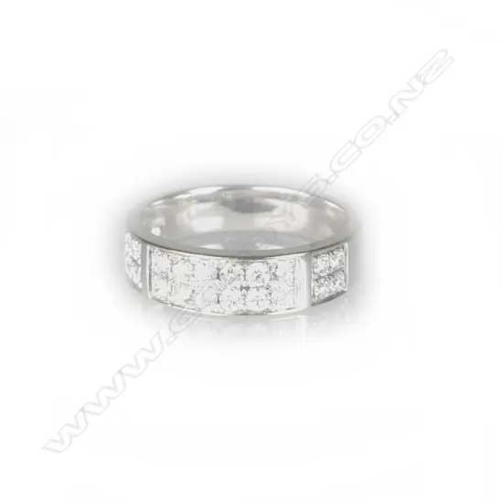 An 18ct. white gold and multi diamond band ring
