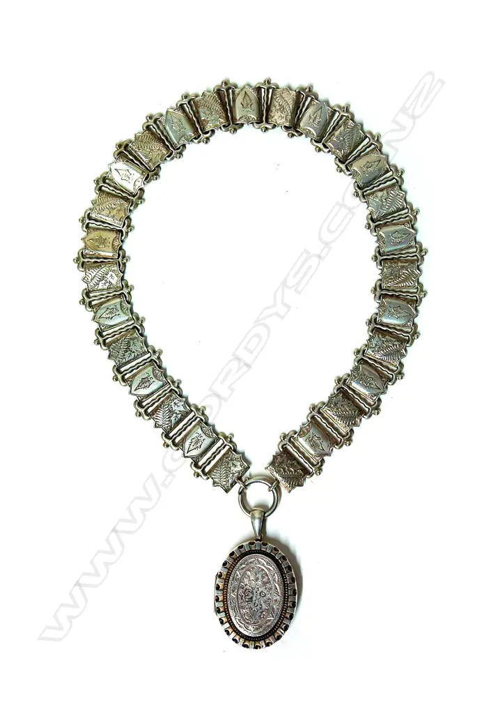 A Victorian silver decorative wide neck chain and locket Image 1++