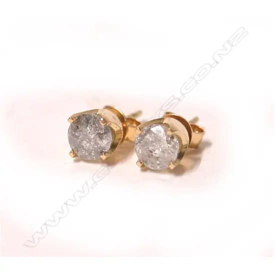 A pair of large modern brilliant cut diamond solitaire earrings in 18ct. yellow gold