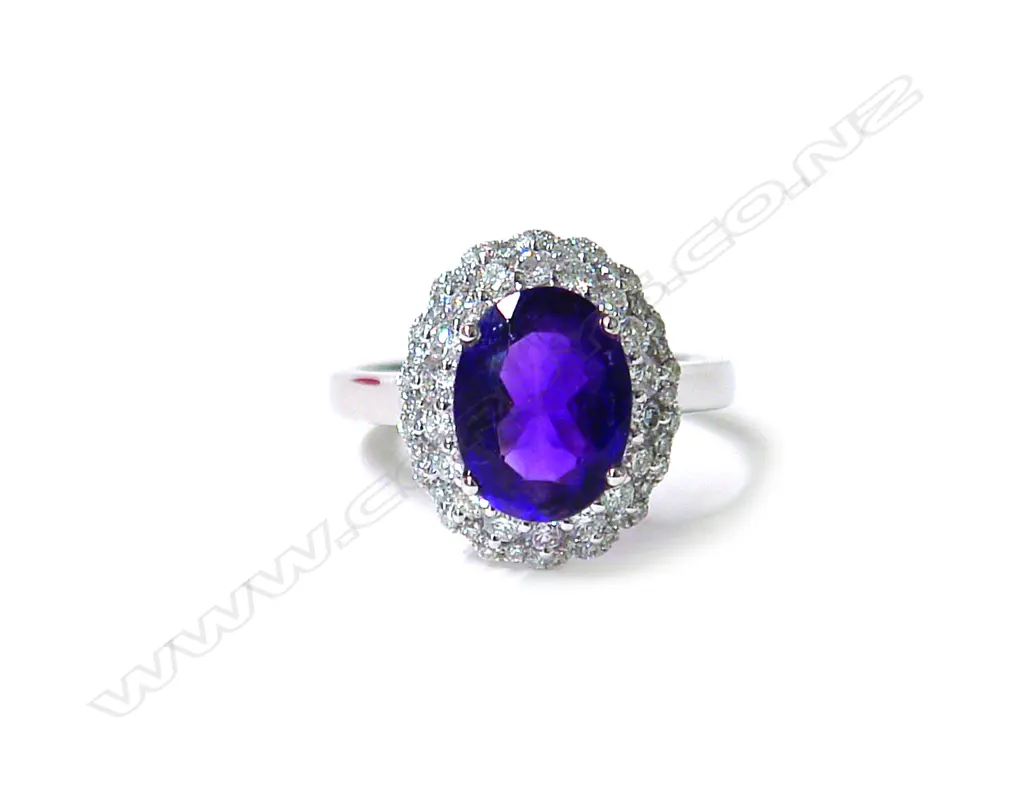 A modern 18ct. white gold amethyst and diamond cluster ring Image 1++