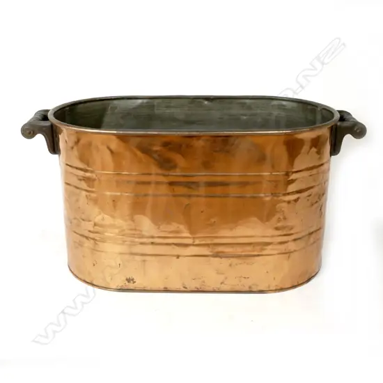 An old copper alfresco wine cooler