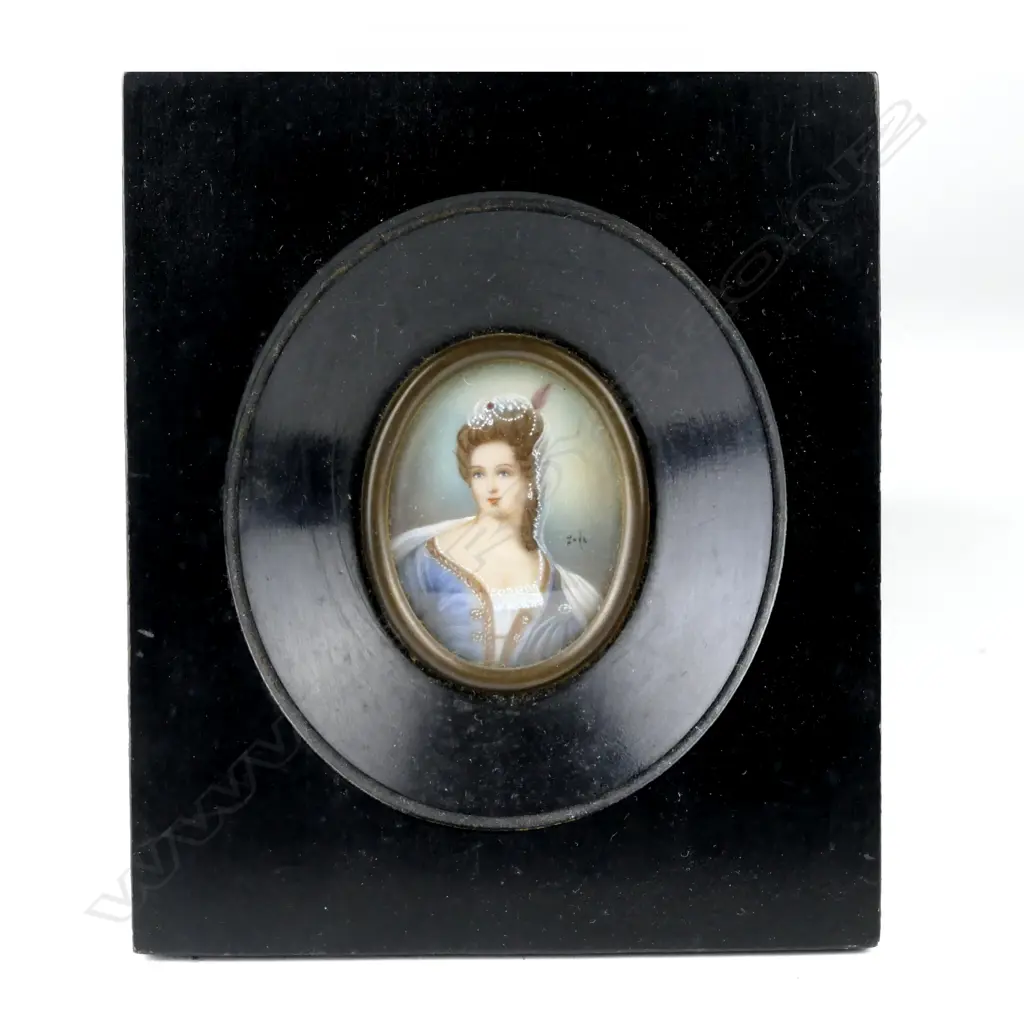 An oval painted miniature of an elegant woman Image 1++
