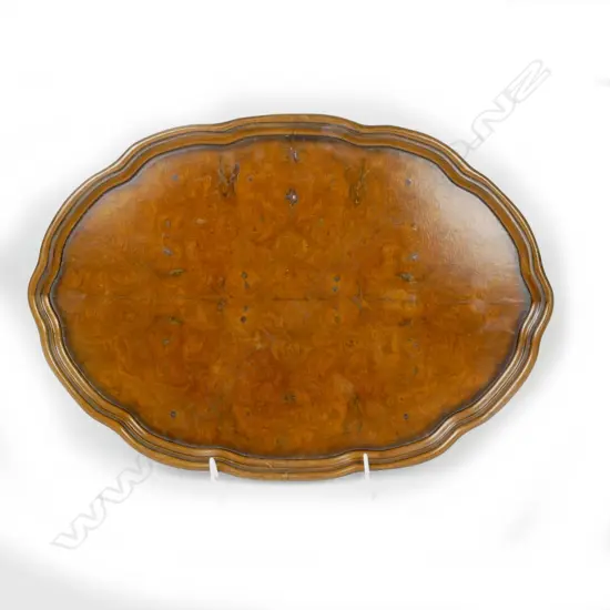 A quality shaped oval burr walnut tray