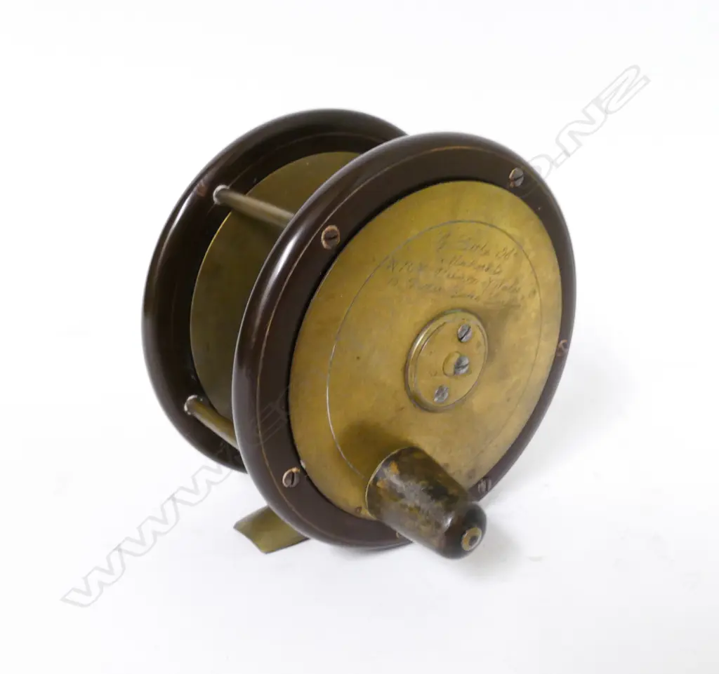A 4" x 2⅛" ebonite and brass salmon reel Image 1++