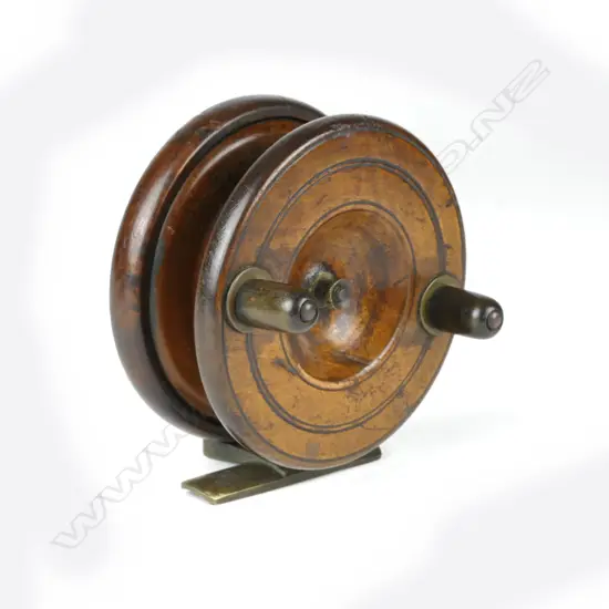 A 4" walnut free-spooling reel
