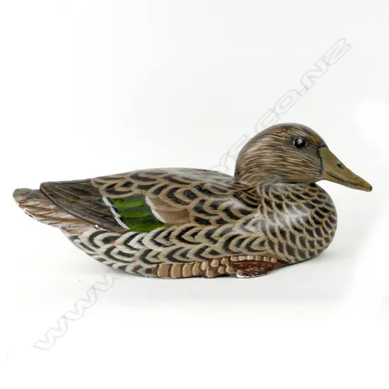 A hand carved green wing teal decoy