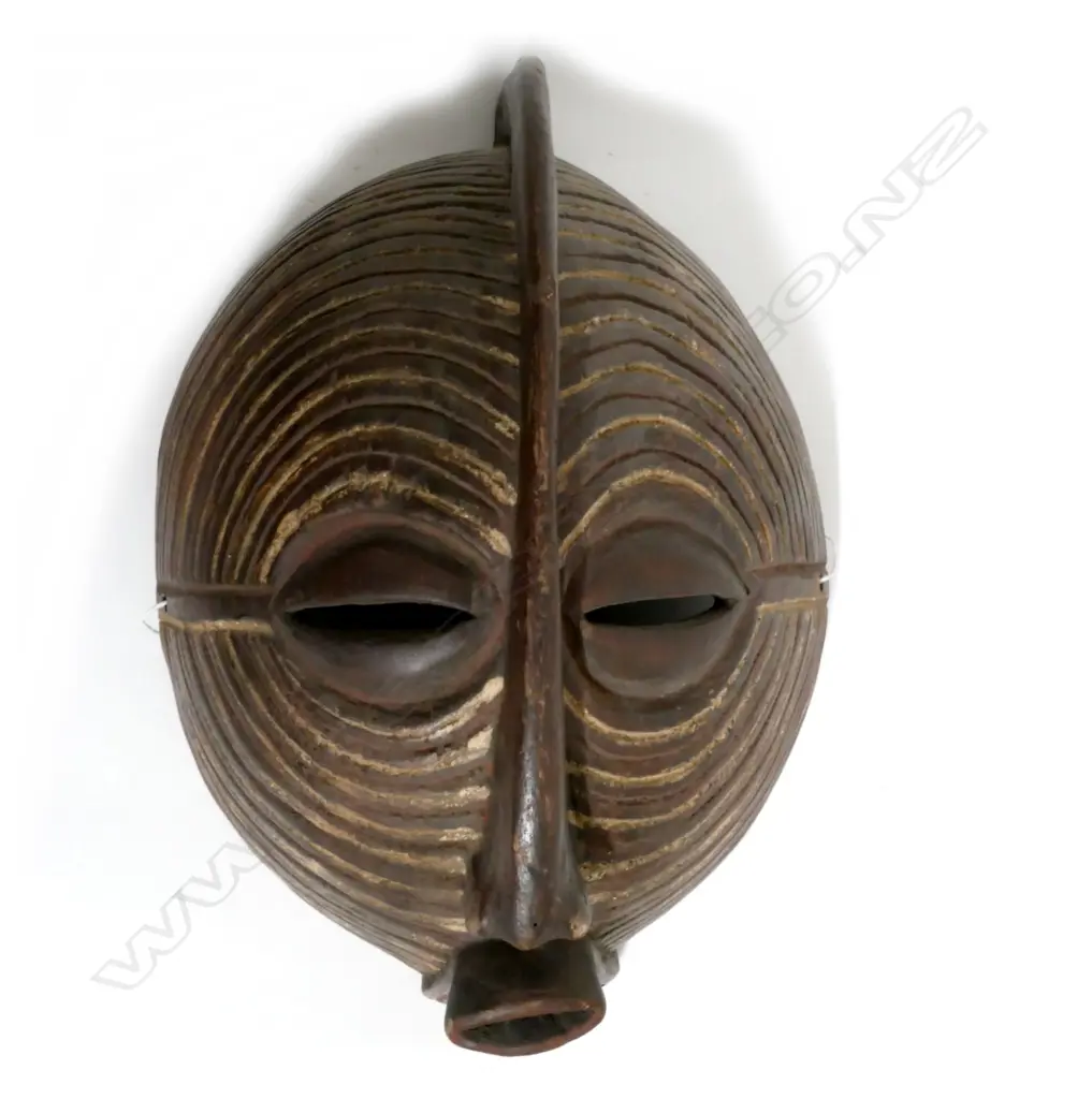 A wooden African face mask Image 1++