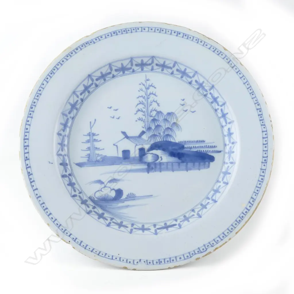 An 18thC Dutch Delft blue and white circular plate Image 1++