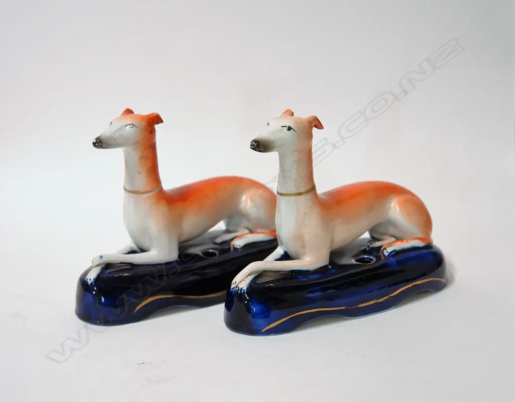 A pair of Staffordshire inkwells as recumbent greyhounds Image 1++