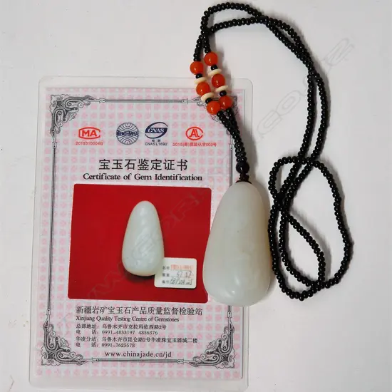 A Chinese pale carved jadeite pendant on bead necklace