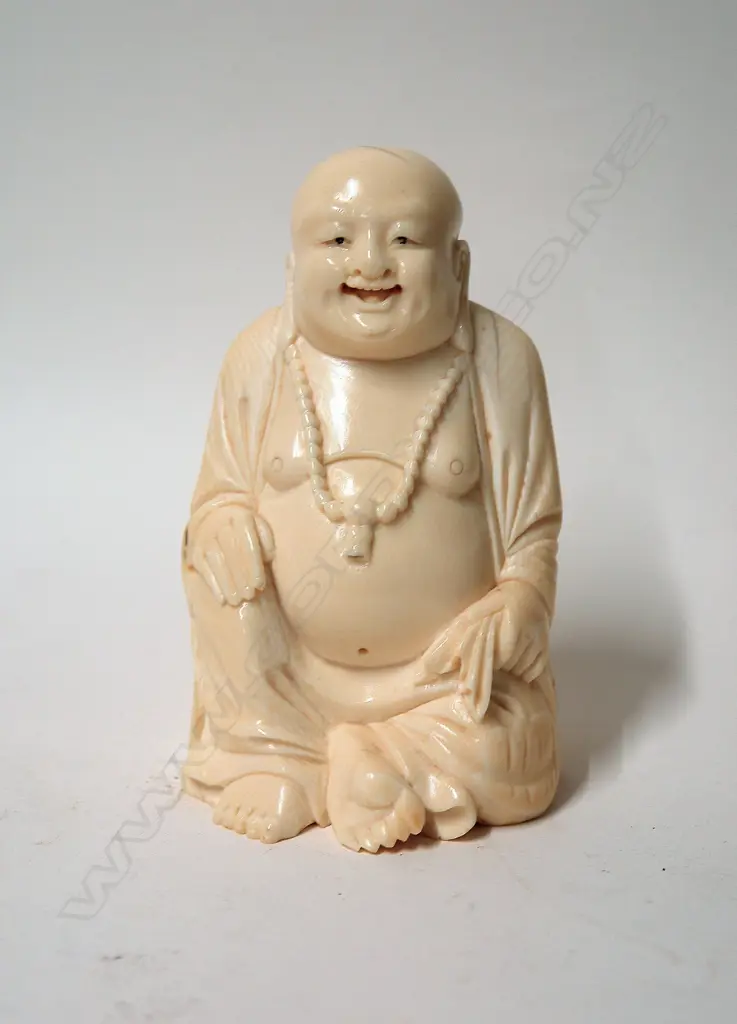 An old Chinese large and solid carved ivory figure of a seated Buddha Image 1++