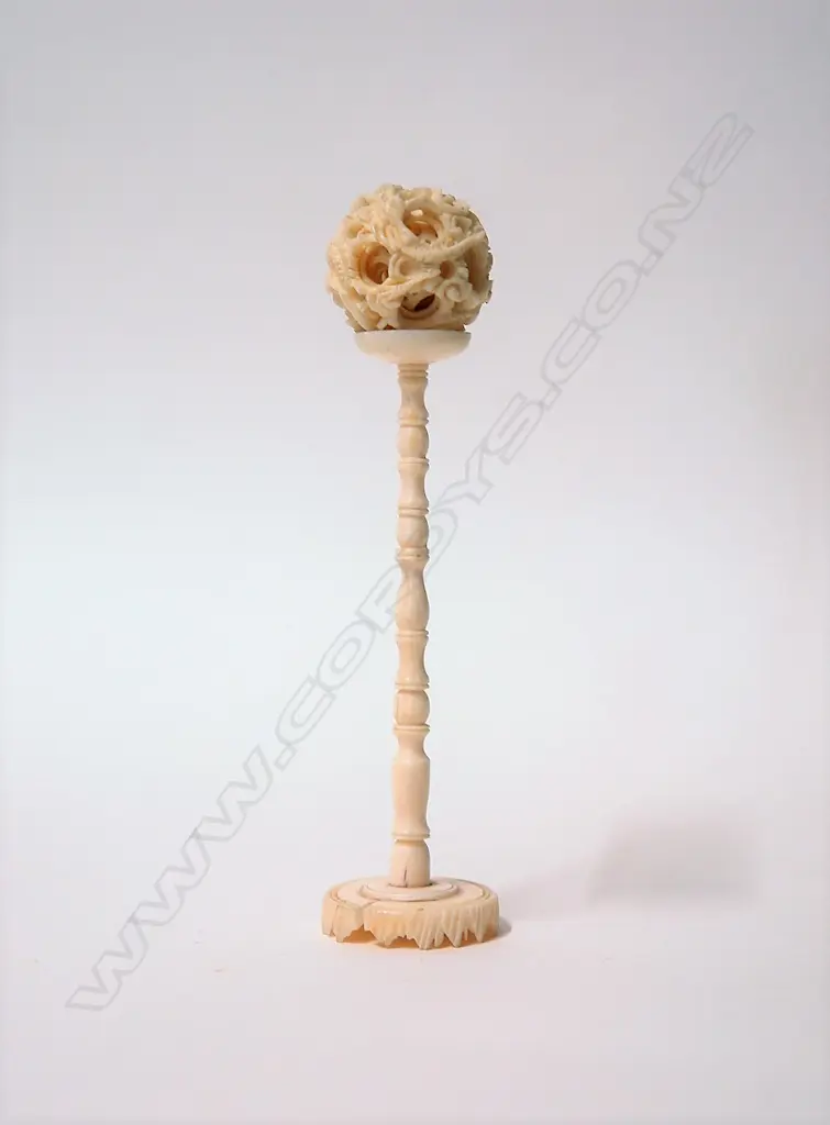 A vintage Chinese carved ivory small puzzle ball on stand Image 1++