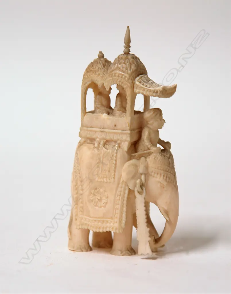 A vintage Indian finely carved ivory elephant with howdah Image 1++