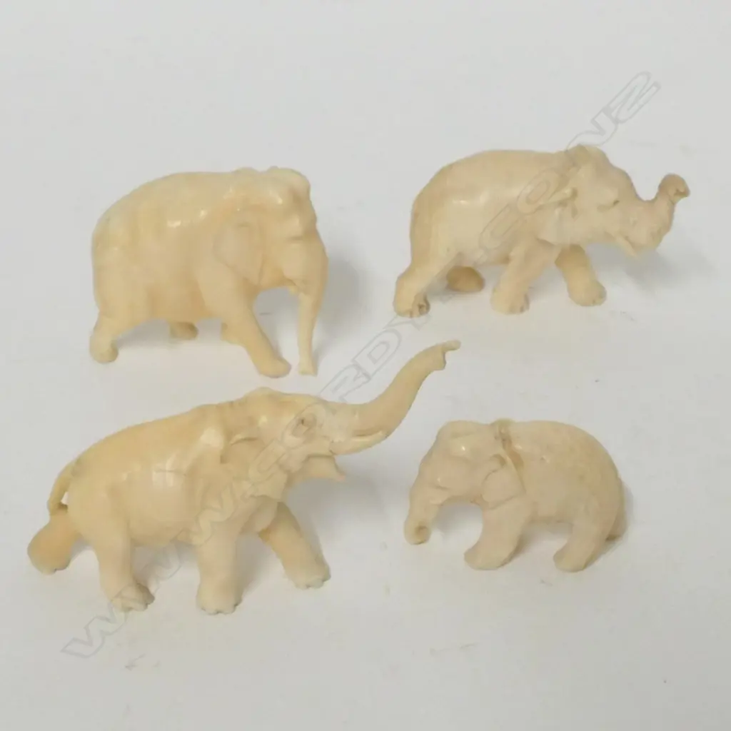 Four small old ivory carved elephants Image 1++