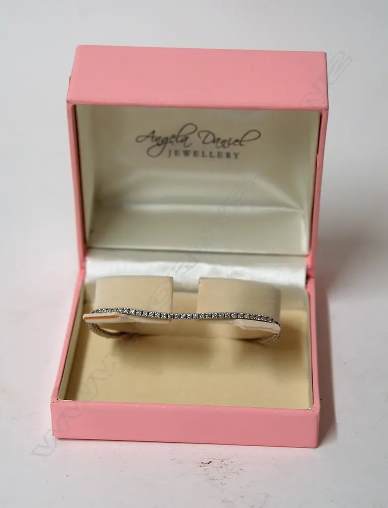 A modern Angela Daniel 18ct. white gold and diamond set tennis bracelet Image 1++