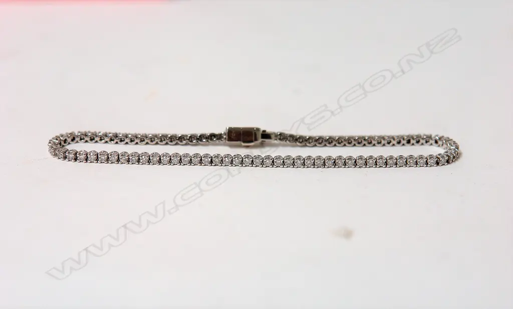 A modern Angela Daniel 18ct. white gold and diamond set tennis bracelet Image 1++