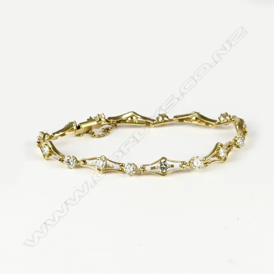 An 18ct. gold and diamond bracelet