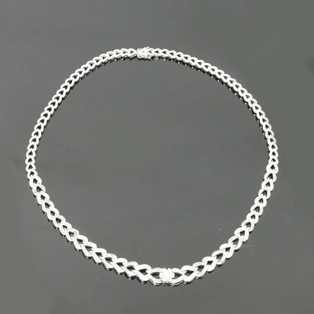 A 14ct. white gold and diamond necklace Image 1++