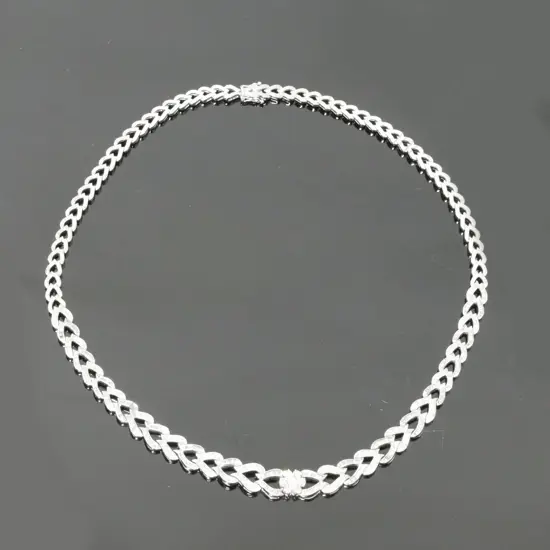 A 14ct. white gold and diamond necklace