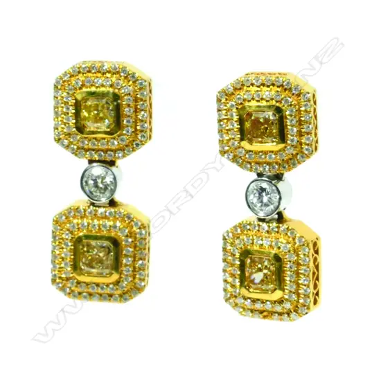 An impressive pair of 14ct. gold and diamond earrings