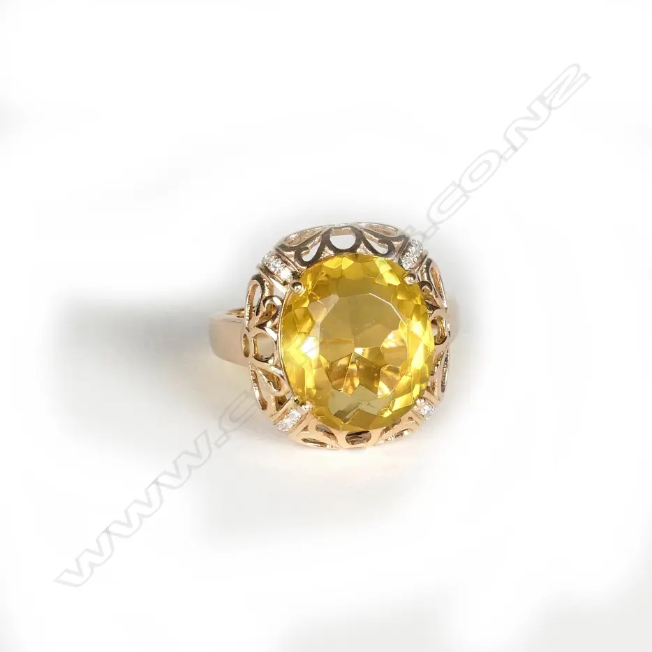 An 18ct. yellow gold large citrine and diamond dress ring Image 1++
