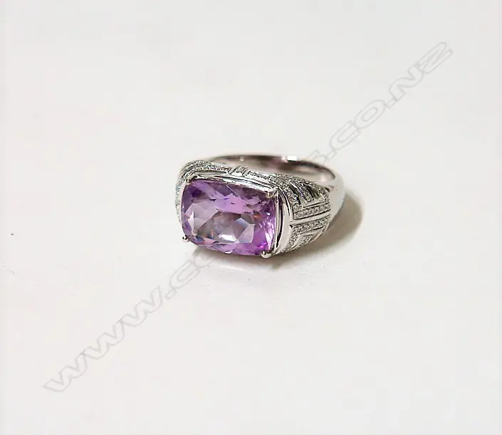 A lady's modern 18ct. white gold amethyst and diamond dress ring Image 1++