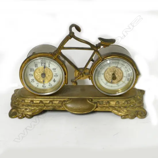 An Edwardian brass desk clock and barometer