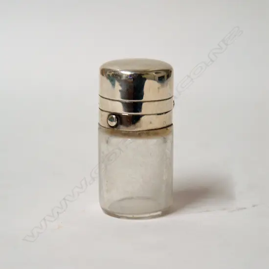 A Victorian silver and glass smelling salts jar