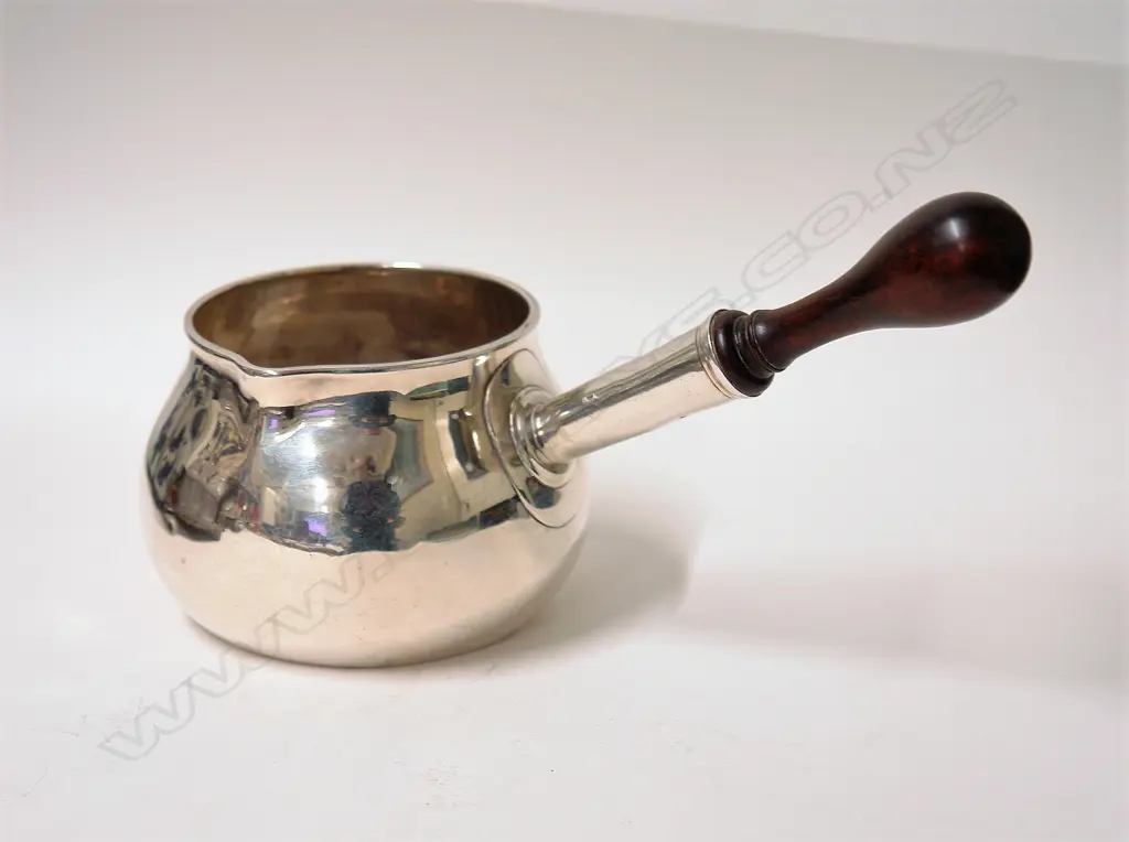 A rare and large Queen Anne silver brandy saucepan Image 1++