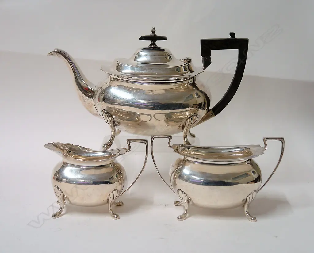 An early 20thC heavy silver three-piece tea service Image 1++