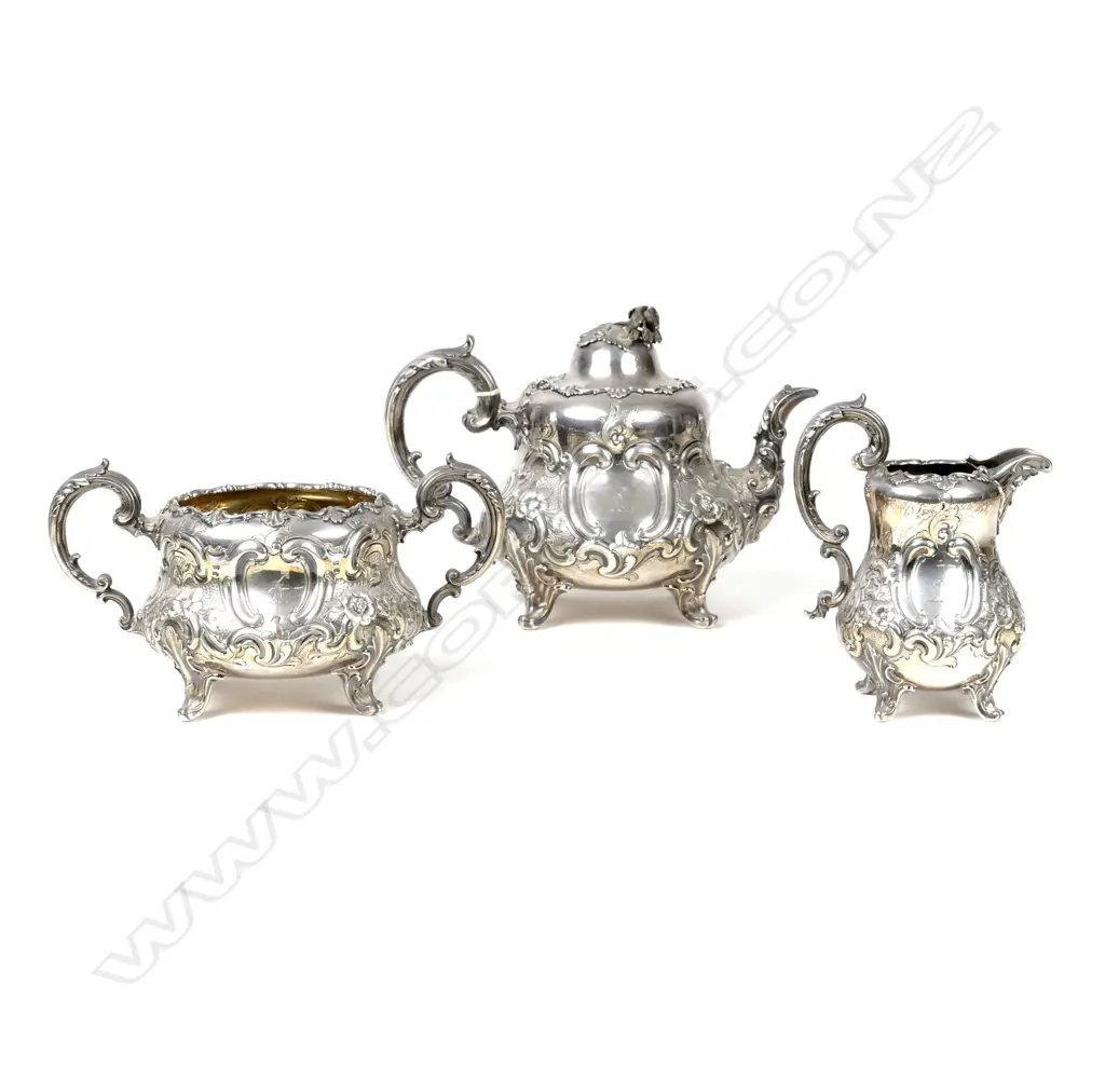 An ornate Victorian three-piece silver crested tea set Image 1++