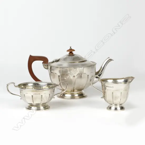 A three piece silver tea set