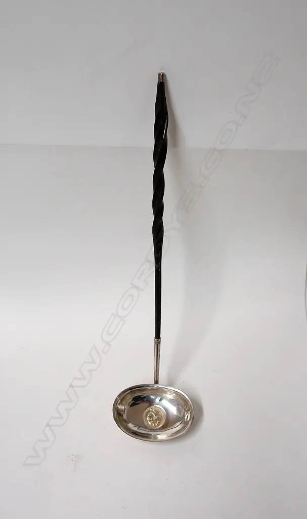 A George III silver and baleen handled toddy ladle Image 1++