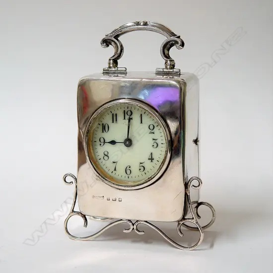 A 1930s silver cased desk clock
