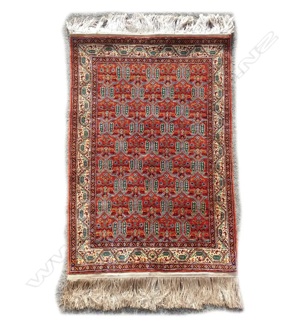 A small finely knotted Persian silk rug Image 1++