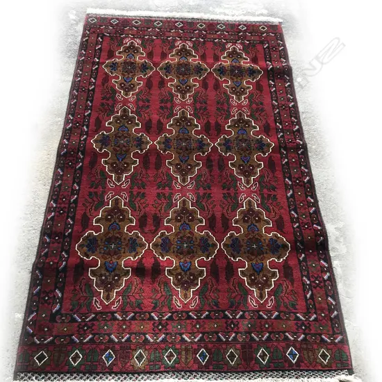 A hand knotted Afghan Baluchi rug