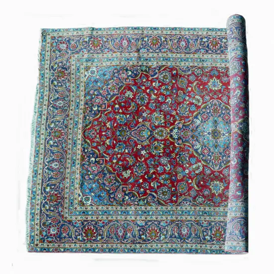 A large hand knotted Persian Kashan carpet