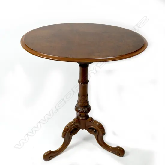 A Victorian walnut oval wine table