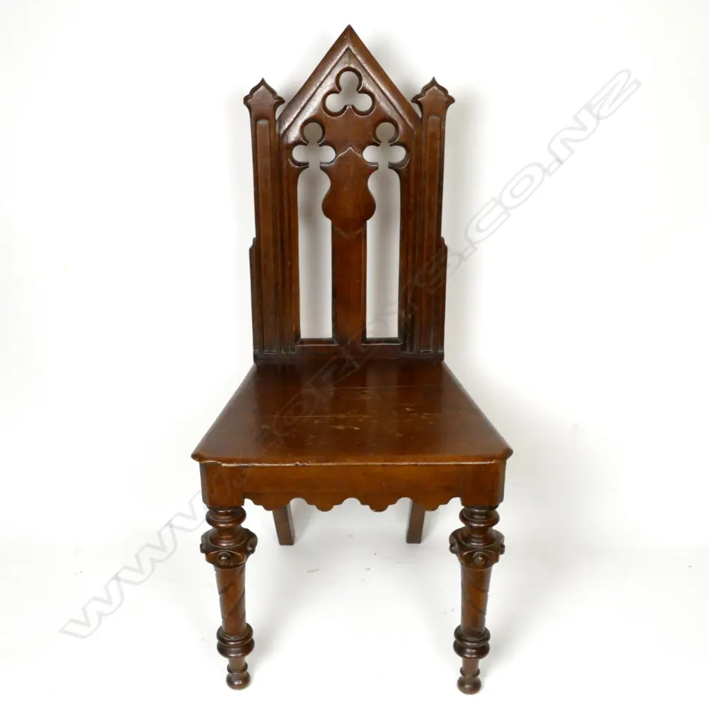A Victorian oak hall chair with carved and pierced decoration Image 1++