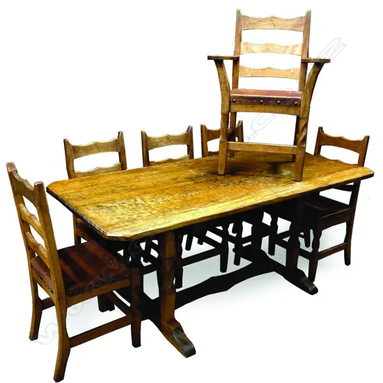 A vintage Chapman Taylor adzed rimu and leather refectory table and six chairs