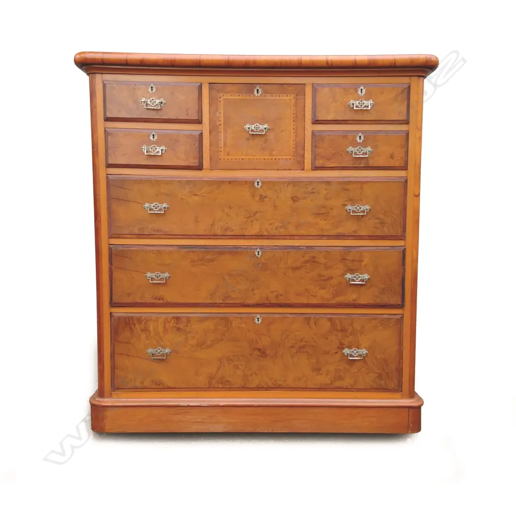 A colonial mottled kauri and rewarewa eight drawer scotch chest Image 1++